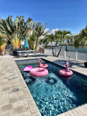 Waterfront Pool Walk to Beach Golf Cart Sleeps 12